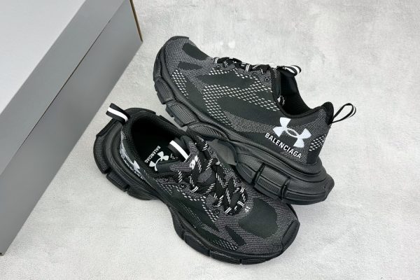 Balenciaga Black Under Armor 3XL Tech Sneakers with futuristic design, breathable mesh panels, and durable rubber sole.