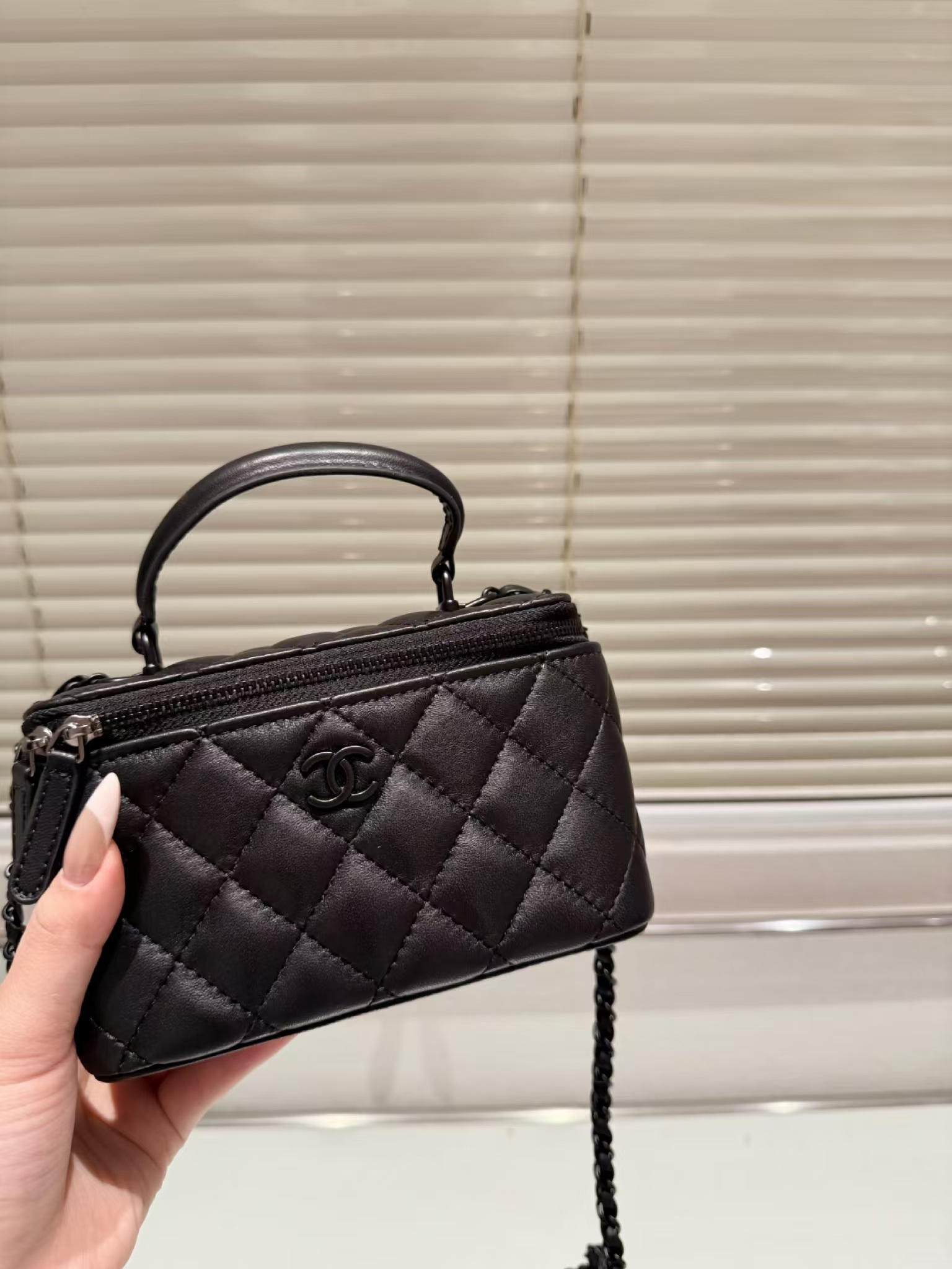 Chanel Classic Lambskin Vanity Bag with Top Handle in black leather