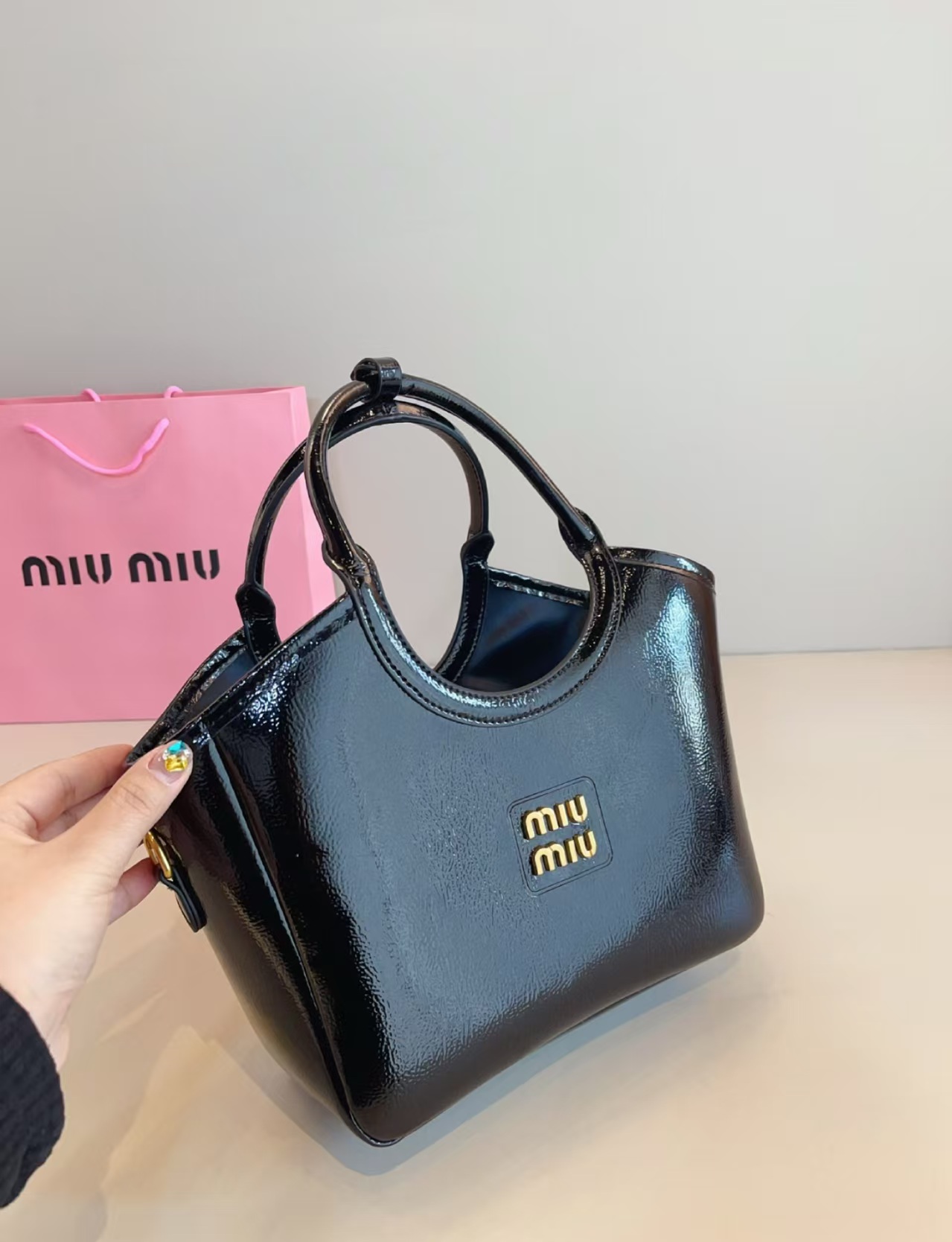 MIU MIU IVY Leather Tote Bag in black with iconic MIU MIU logo